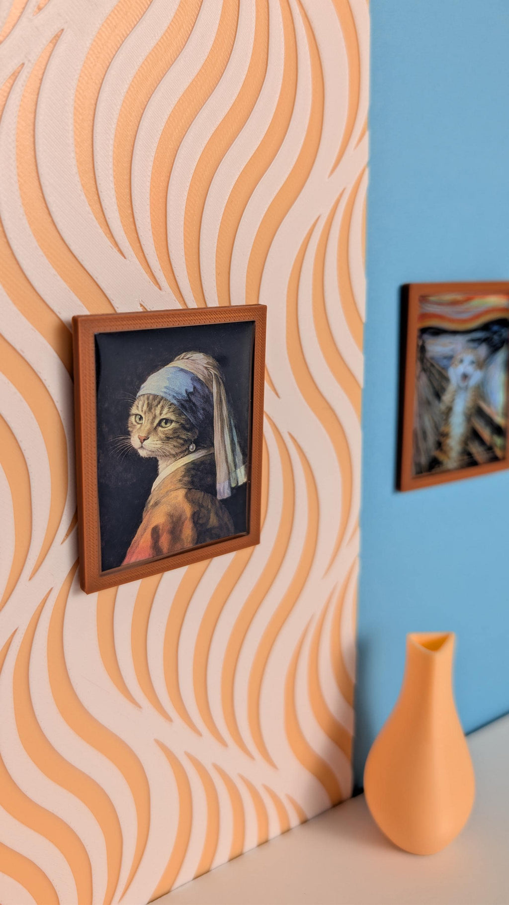 Famous paintings reimagined with cats in brown miniature frames