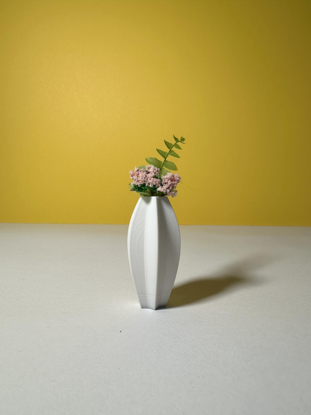 Star shaped miniature vases viewed from the front
